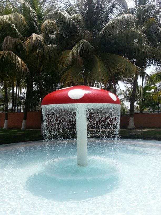 Mushroom water feature in a sparkling pool